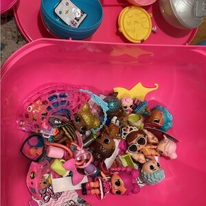 SOLD L.O.L. Dolls in pink case